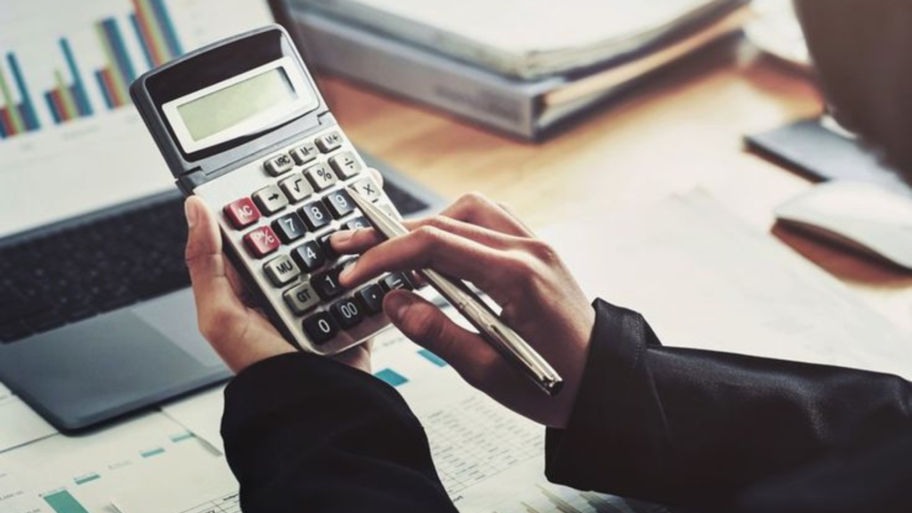 Woman holding a calculator