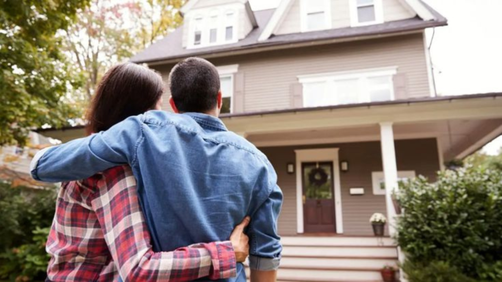 Couple in front of a house