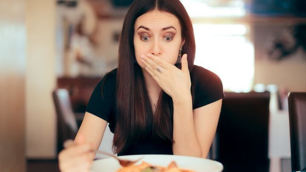 Woman overwhelmed by a meal