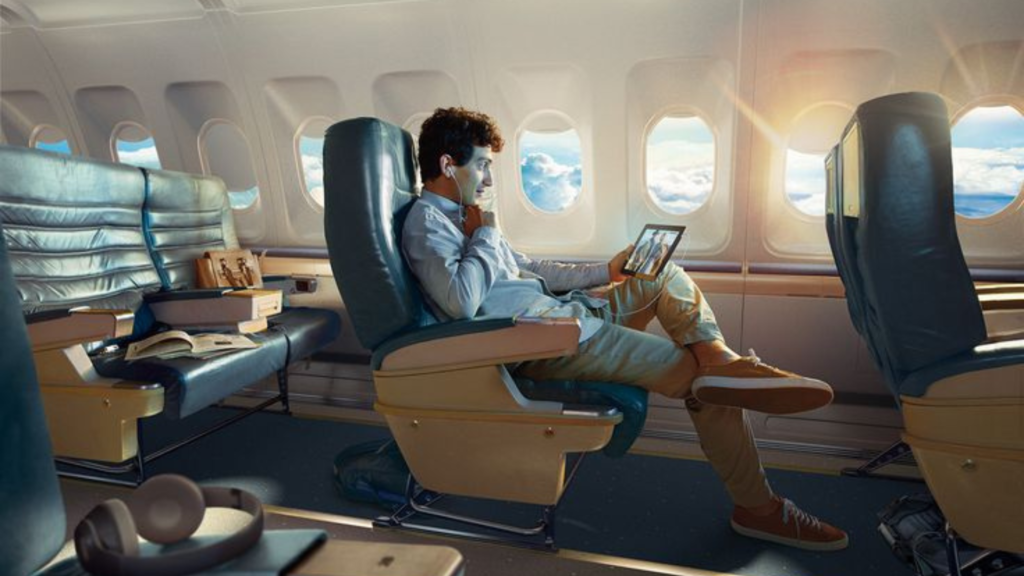 Flight passenger looking at an iPad 