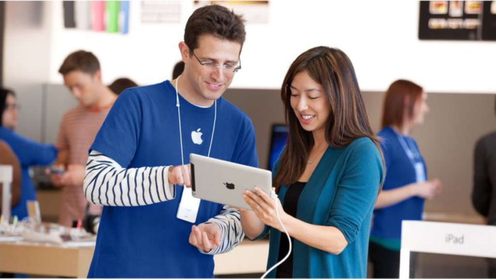 An Apple representative with a customer