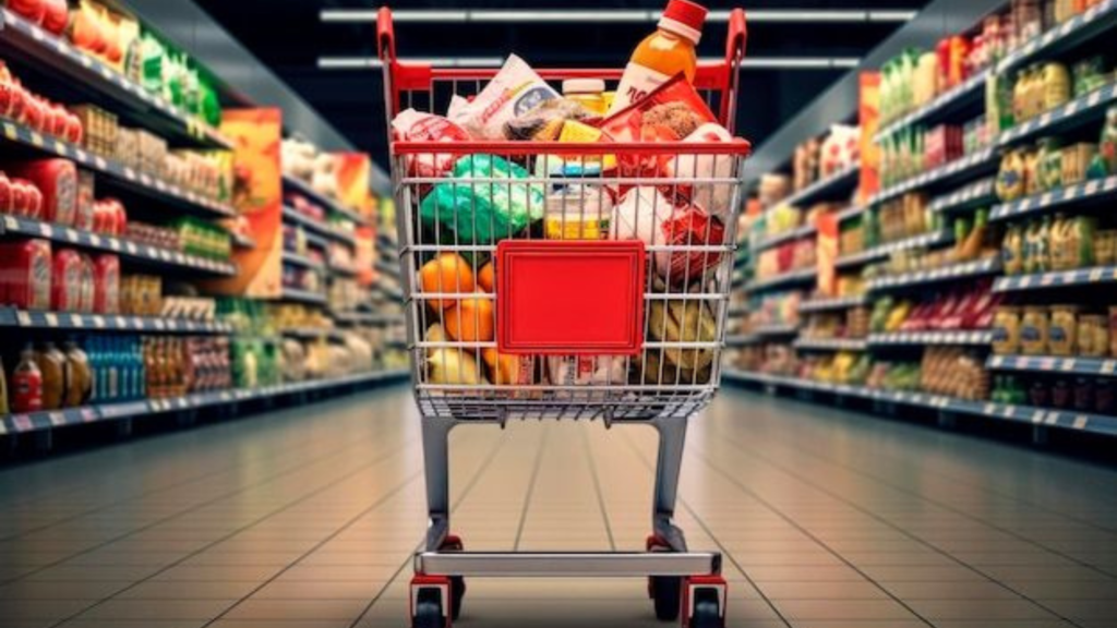 A cart with groceries in the middle of the store