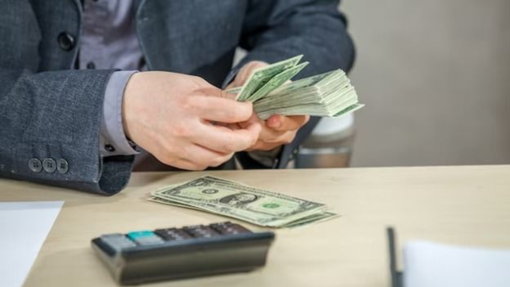 A man counting some money