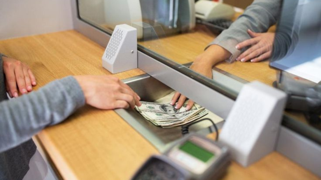 Cashier giving customer cash