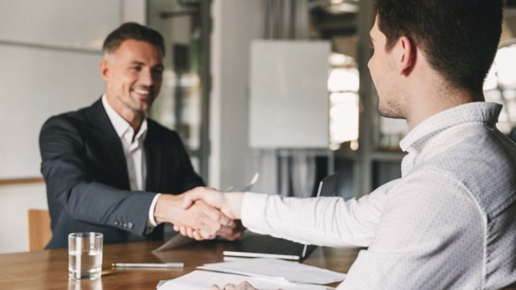 Two men shaking hands in agreement