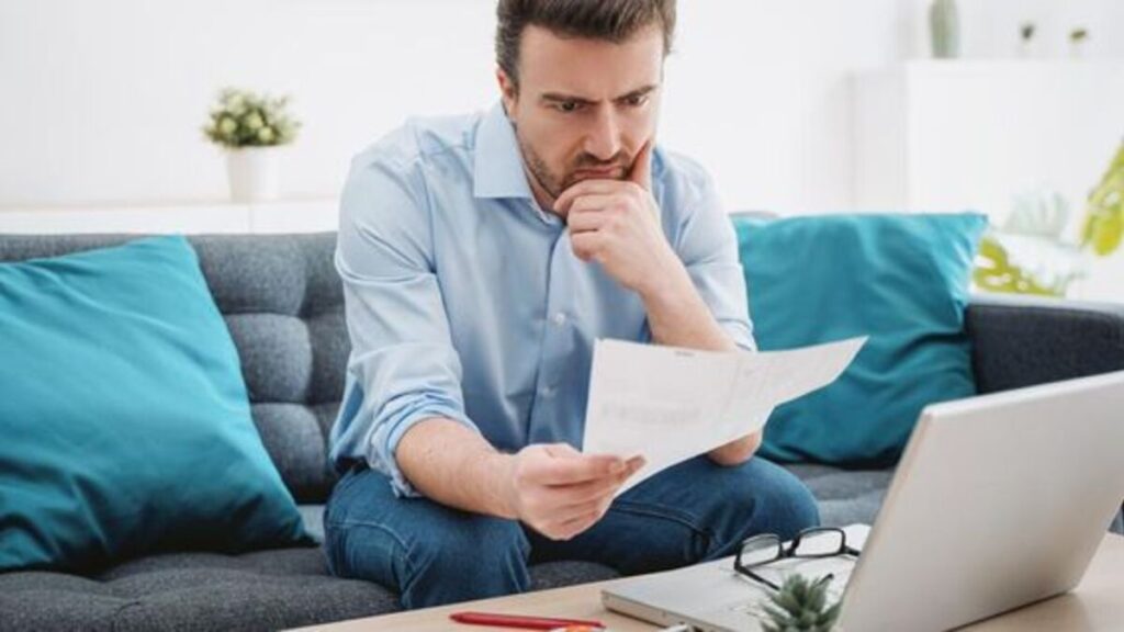 A man looking at a report