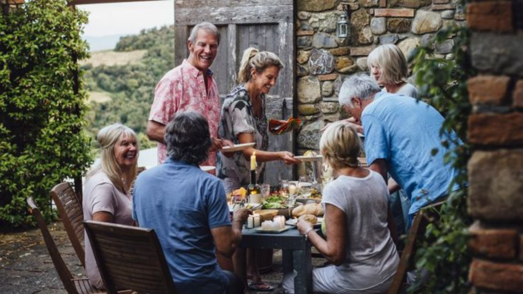 Boomers having lunch with friends outdoors