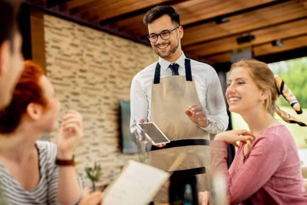 Waiter receiving payment from customers