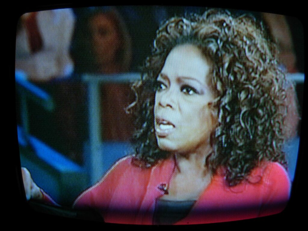 A picture of Oprah speaking during an interview