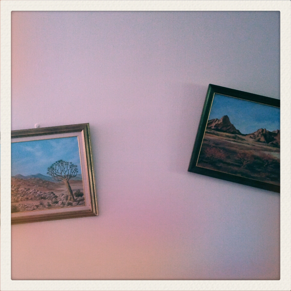 Two frames hanging at odd angles