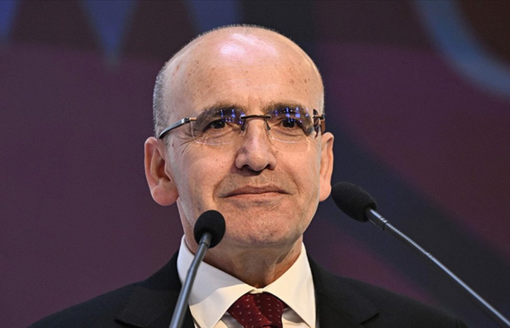 Simsek addressing an audience