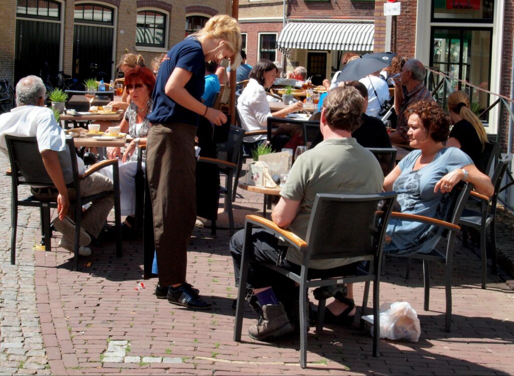 Waitress in a café in the center of underwater, the Netherlands