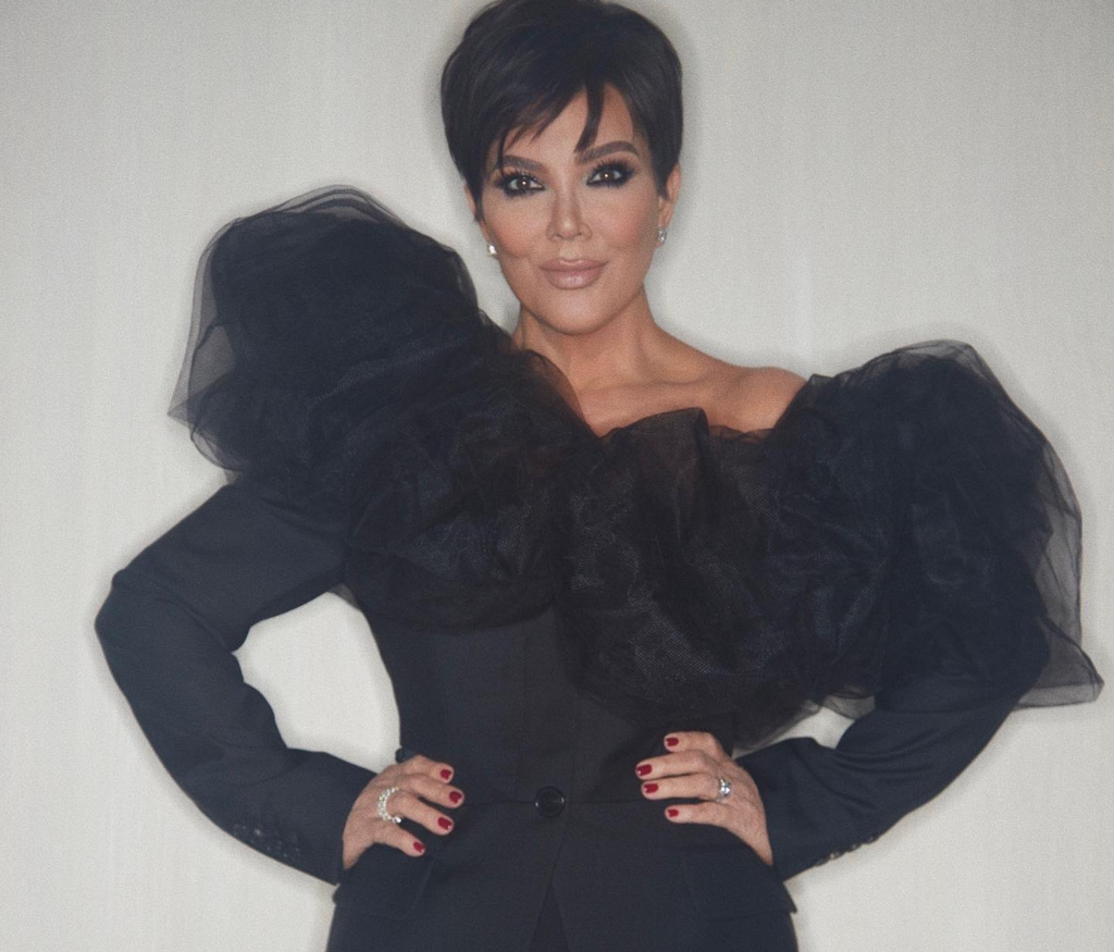 Jenner poses in a black outfit