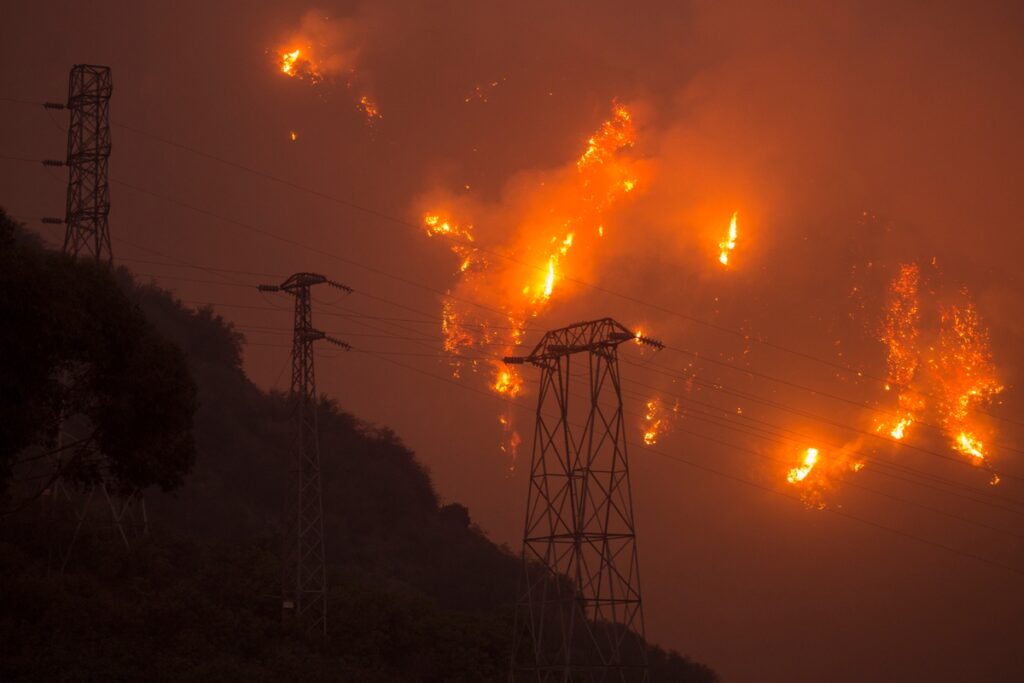 Wildfire raging around pylons