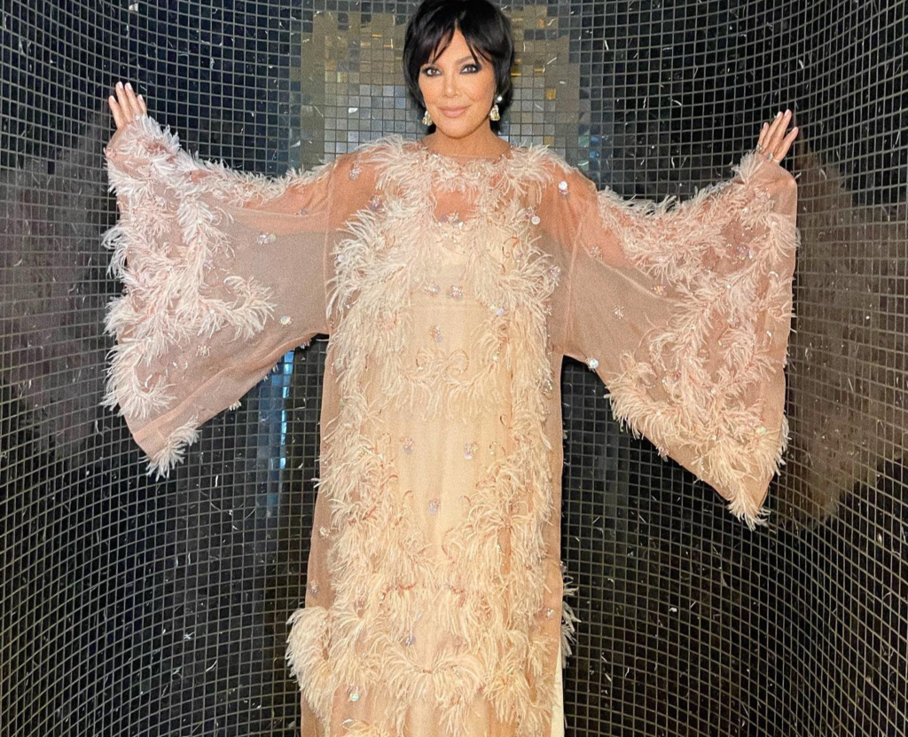 Jenner poses in an angelic full-body gown