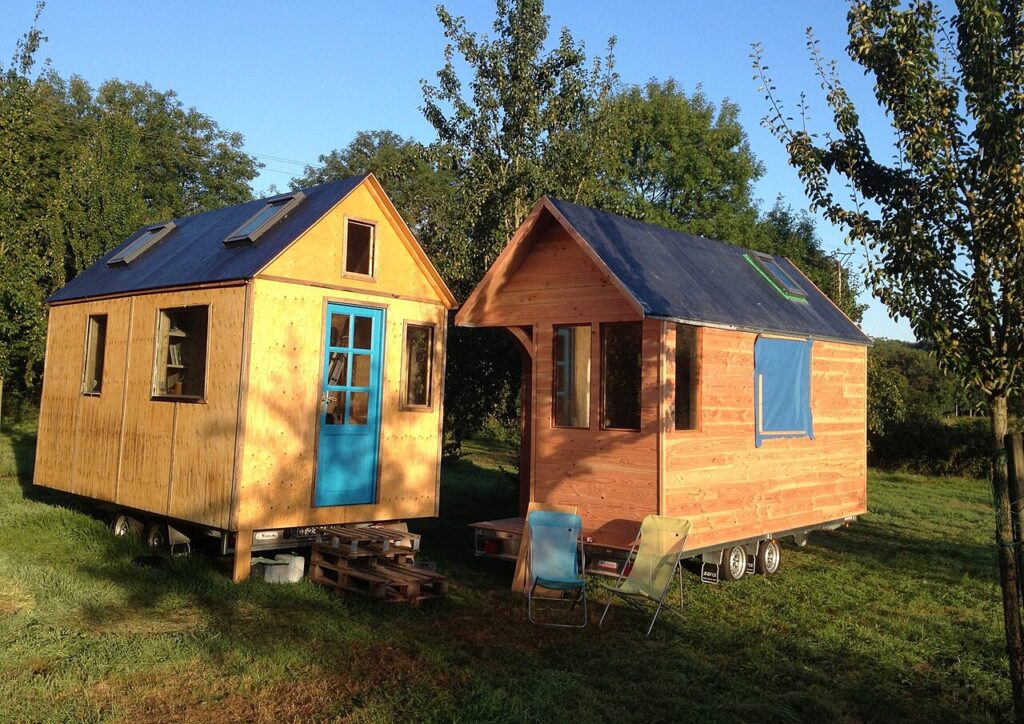 Two tiny houses lined up beside each other