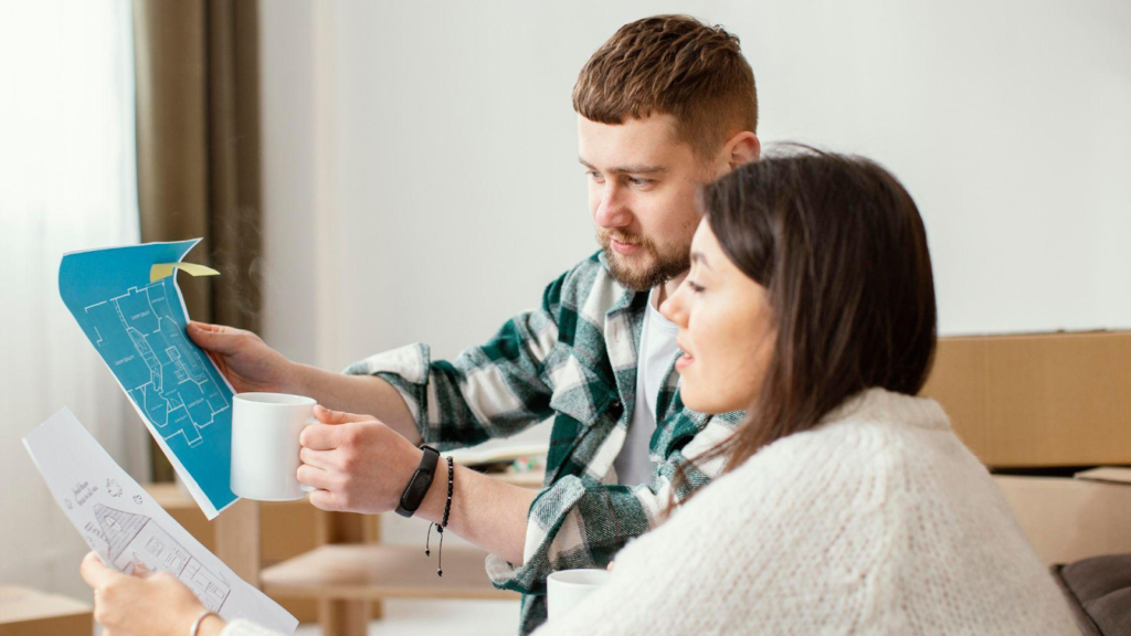 Couple looking at the building plan of a proposed structure