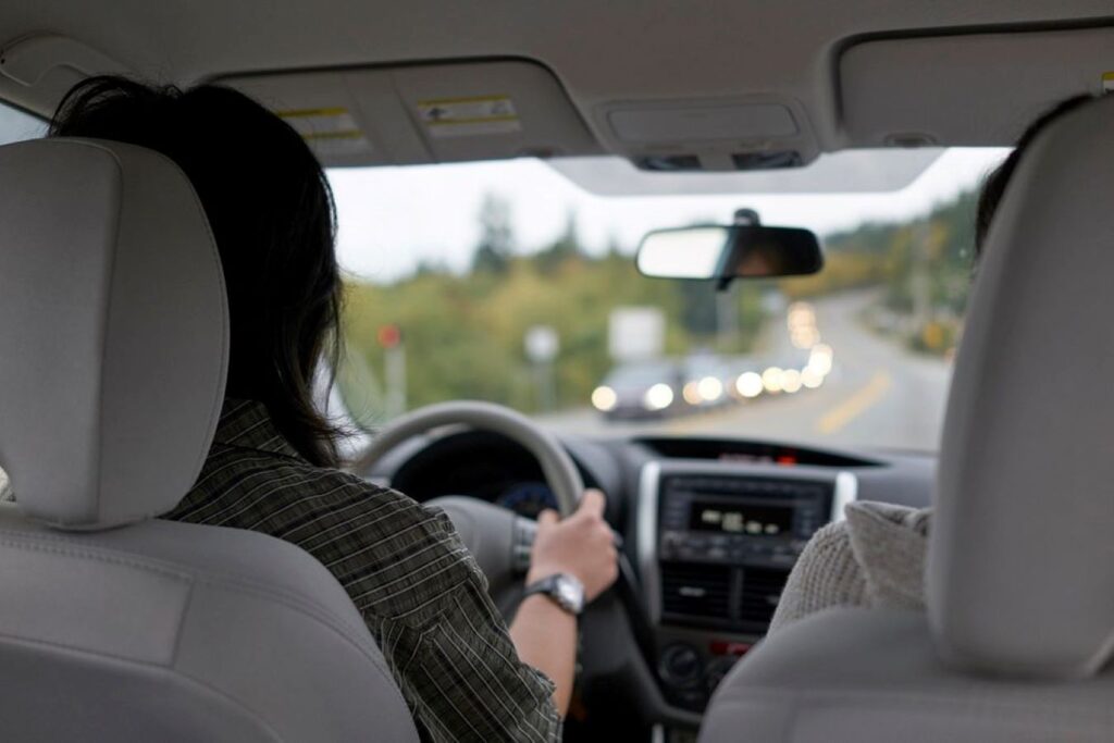 Young lady driving on a highway