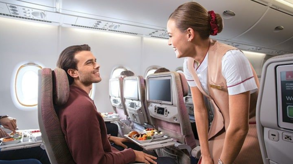 A happy passenger and polite flight attendant