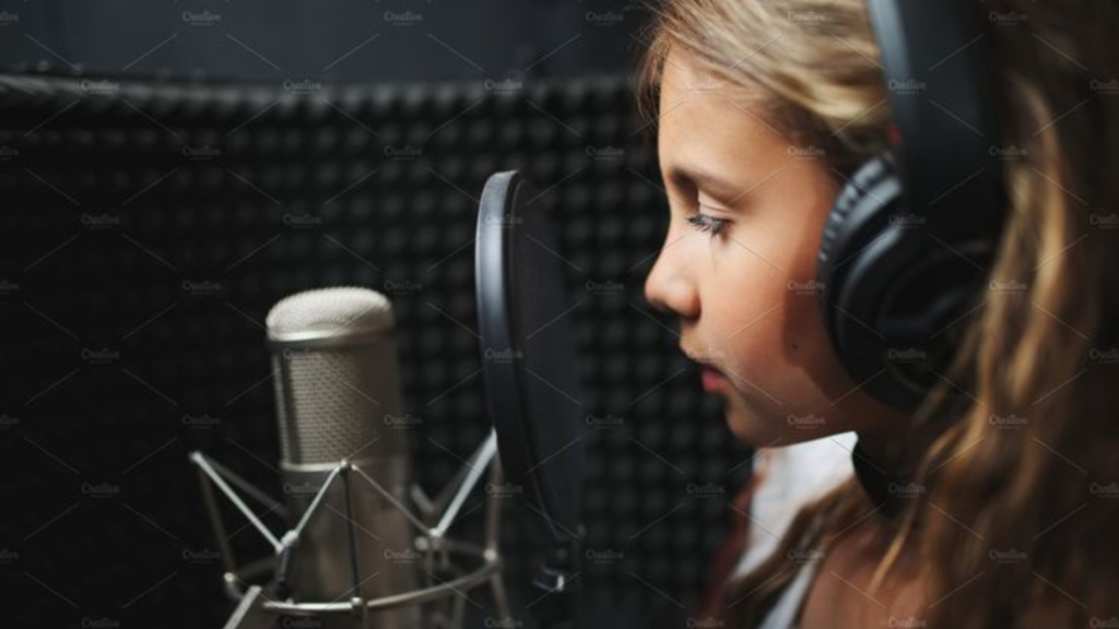 A girl singing in a studio