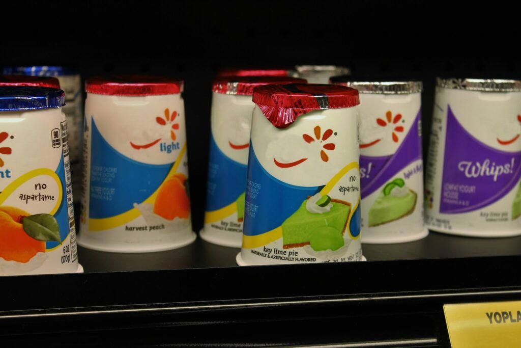 flavoured yogurt on the shelf of a grocery store