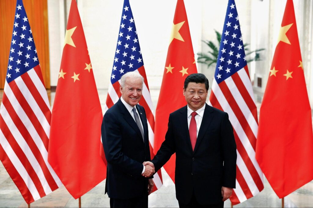 Xi Jinping shakes Joe Biden