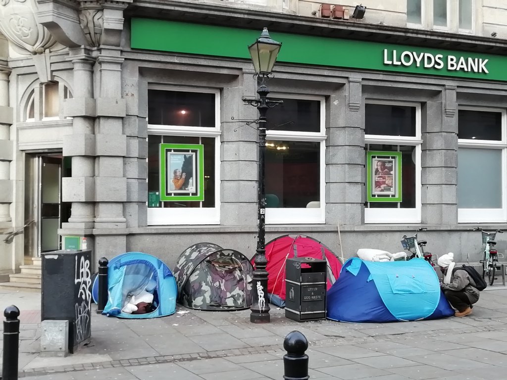 Tents of homeless people in front of a Lloyds bank