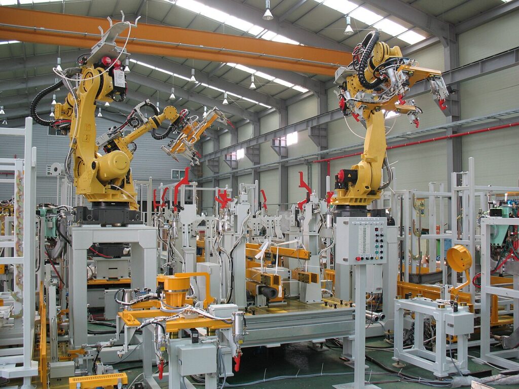 Robotics arms on a production floor