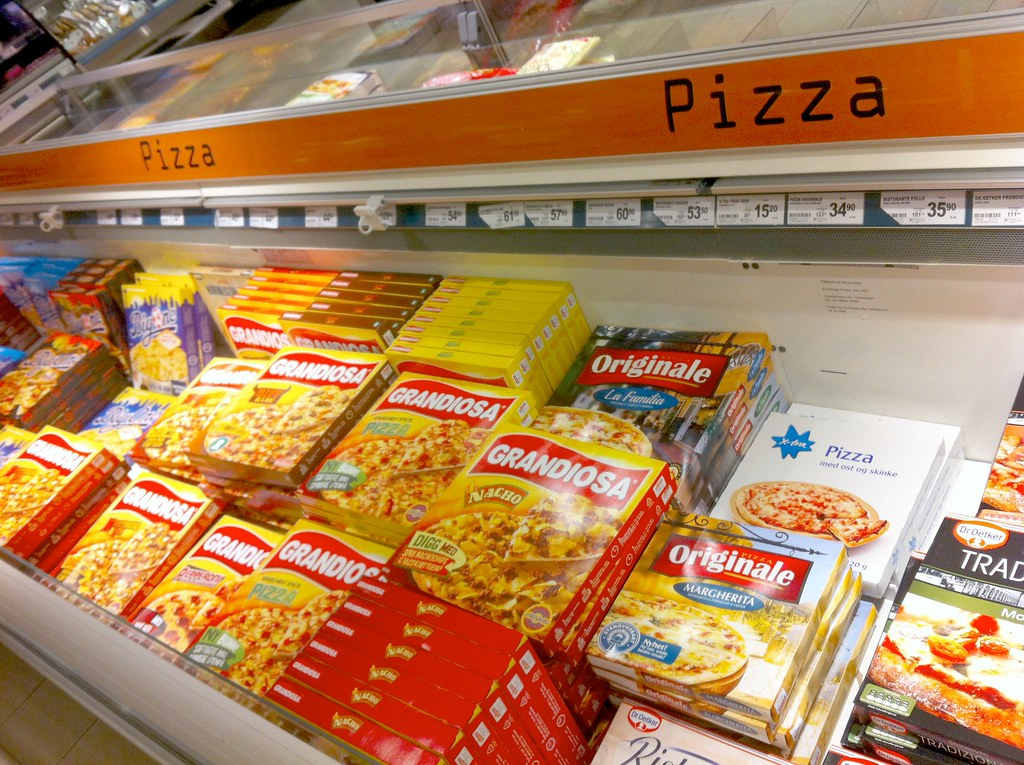 Frozen pizza on display at a food retail store