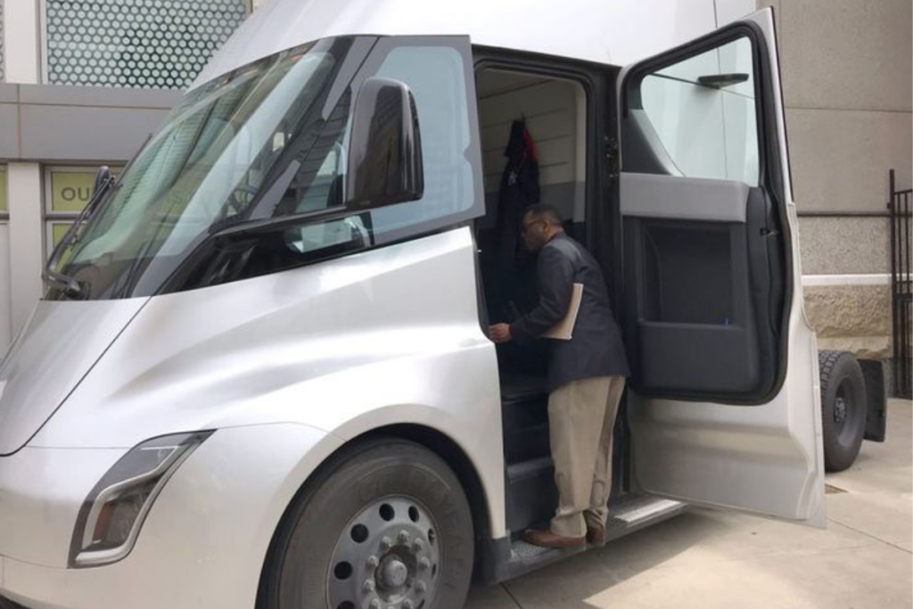 An image of a person in a Tesla electric semi truck