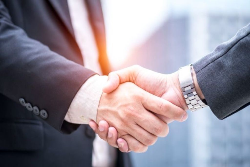 An image of business partners shaking hands