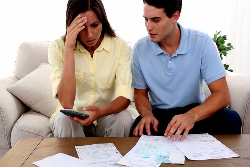 An image of a couple looking over some documents