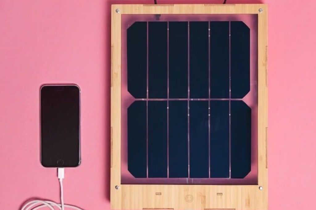 An image of portable solar panels charging a phone