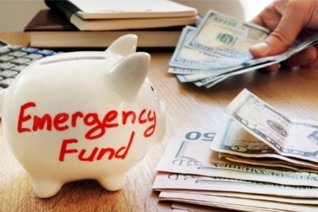 An image showing me emergency fund written on a piggy bank and bank note beside it