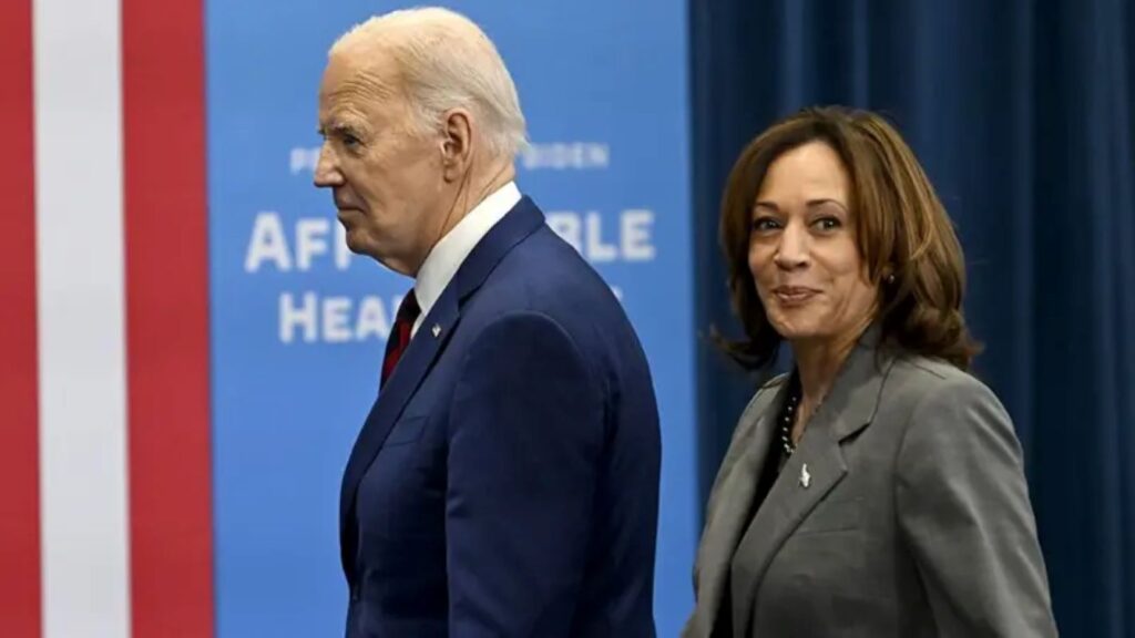 Harris walking alongside Biden. Biden capital gains tax