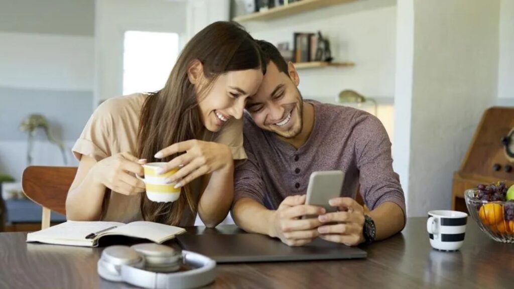 A couple viewing content on a smartphone