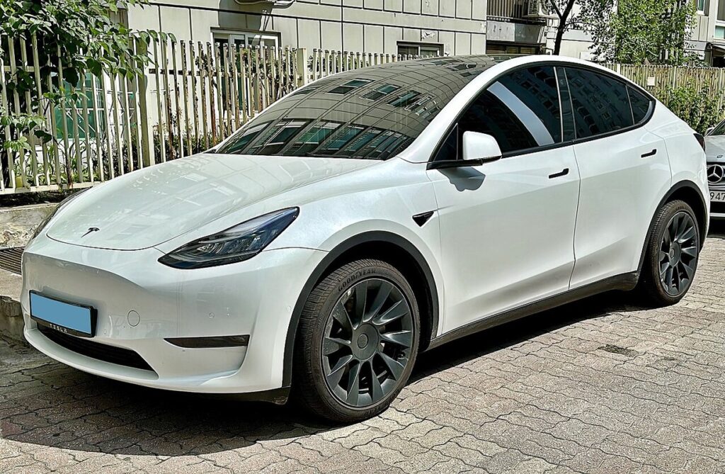 A white Tesla EV