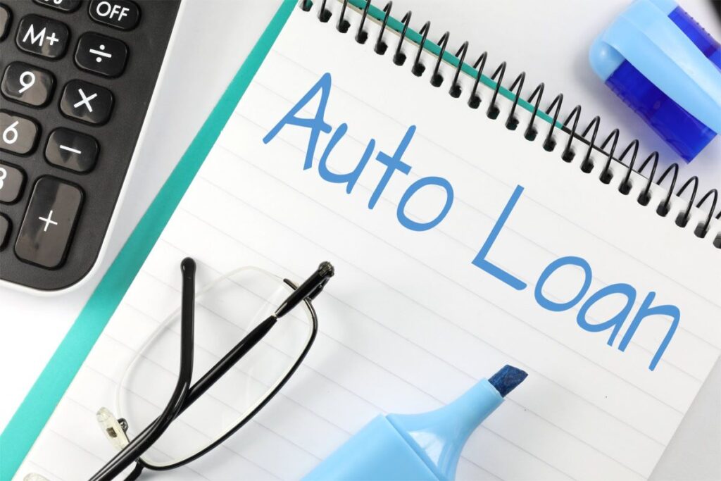 Auto loan written on a ledger