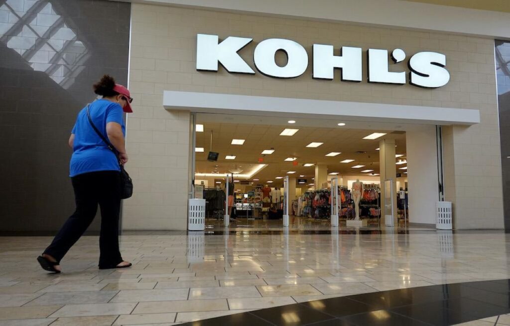 A shopper walking towards a Kohl’s store