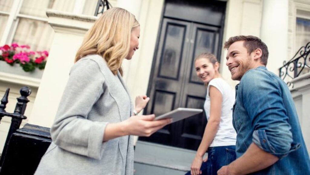 Millennial couple and a real estate agent