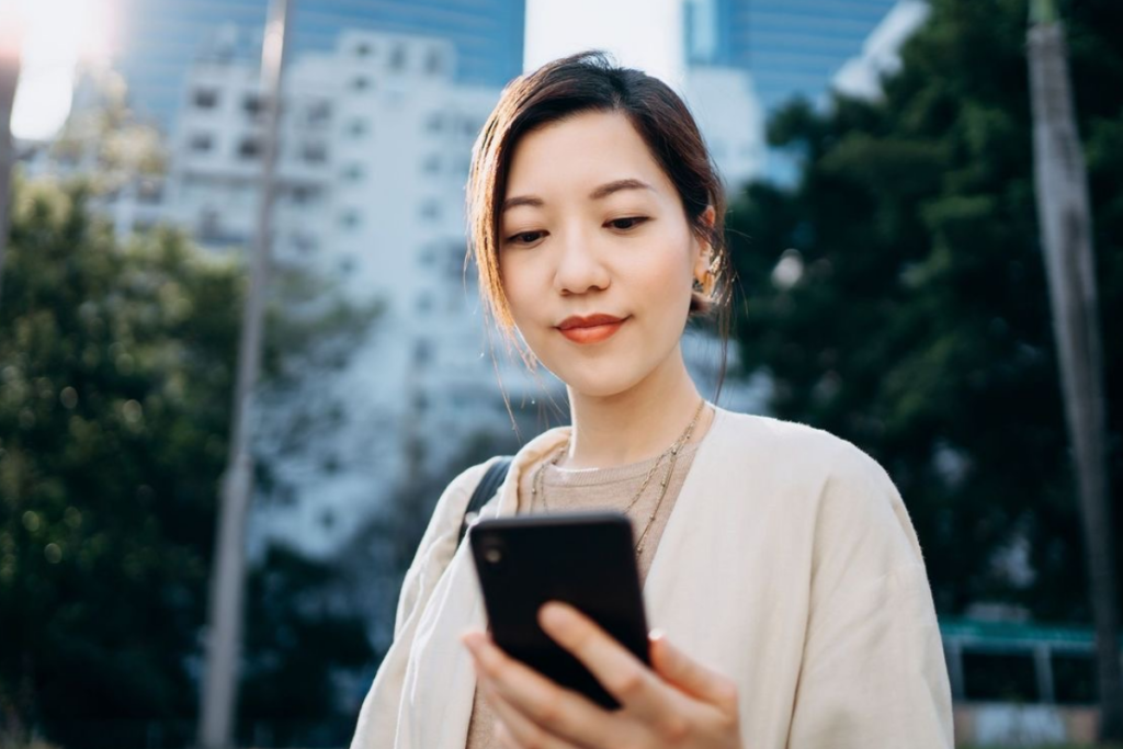 An image of a woman looking at her phone