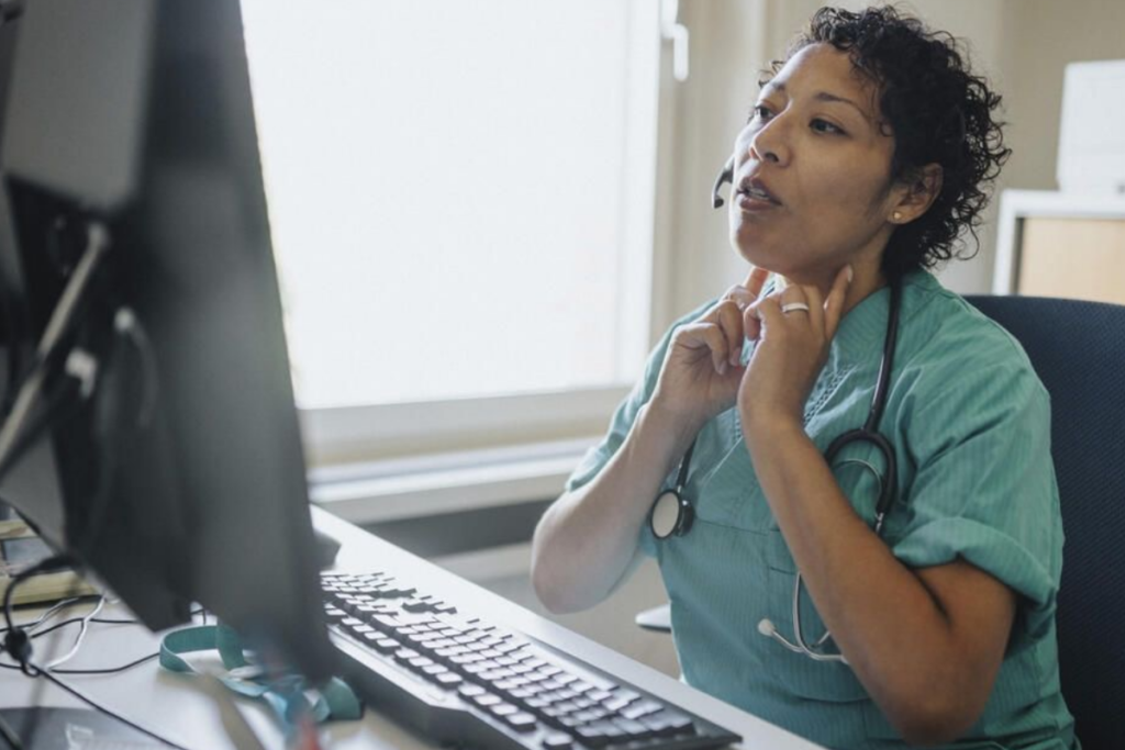 An image of a nurse working from home