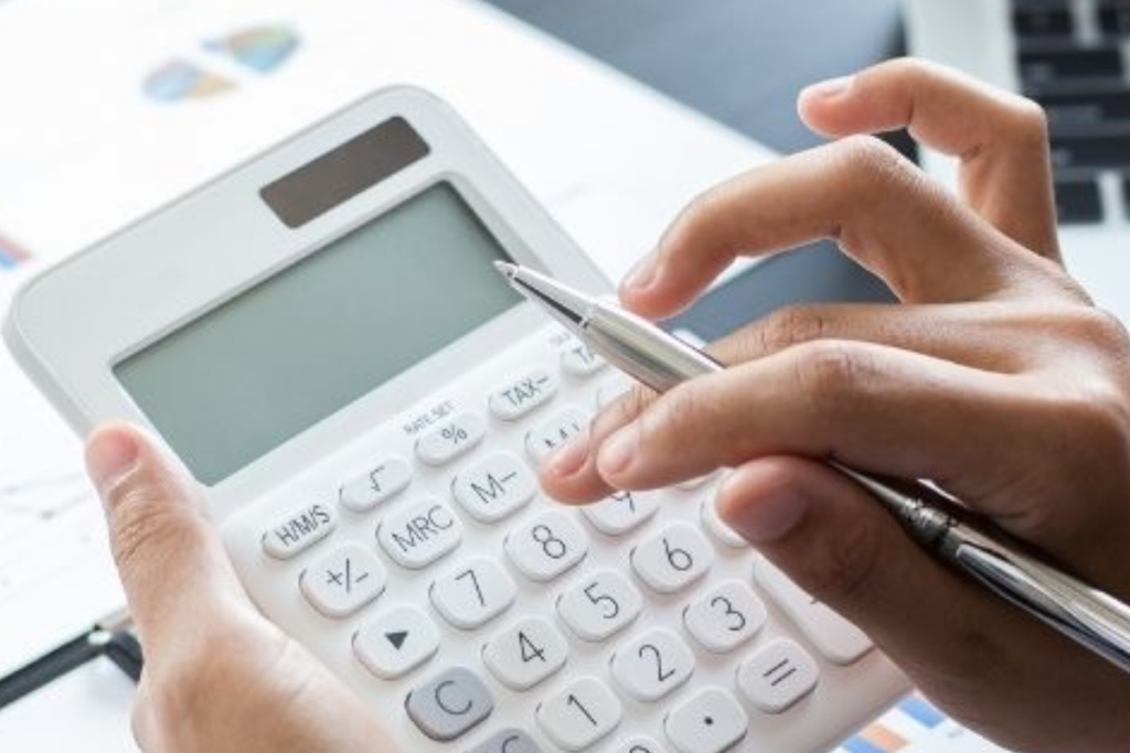 An image of a person using a calculator