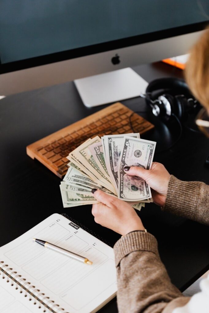 An image of a person counting money