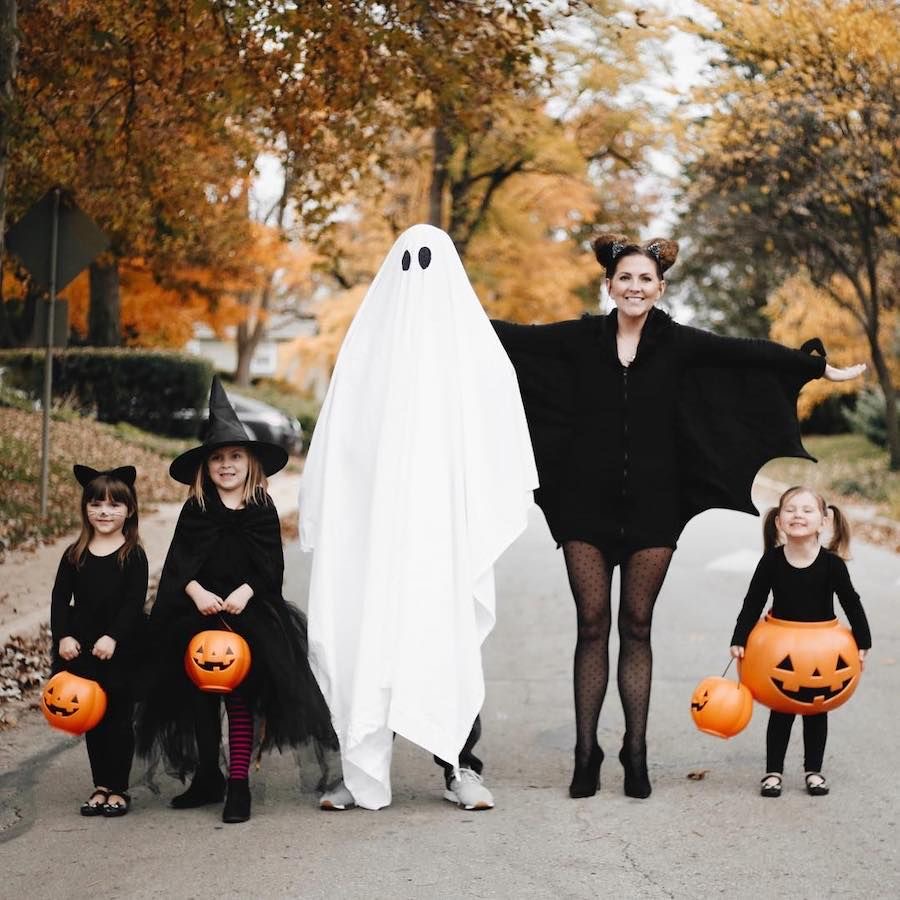 An image of people dressed in classic Halloween costumes