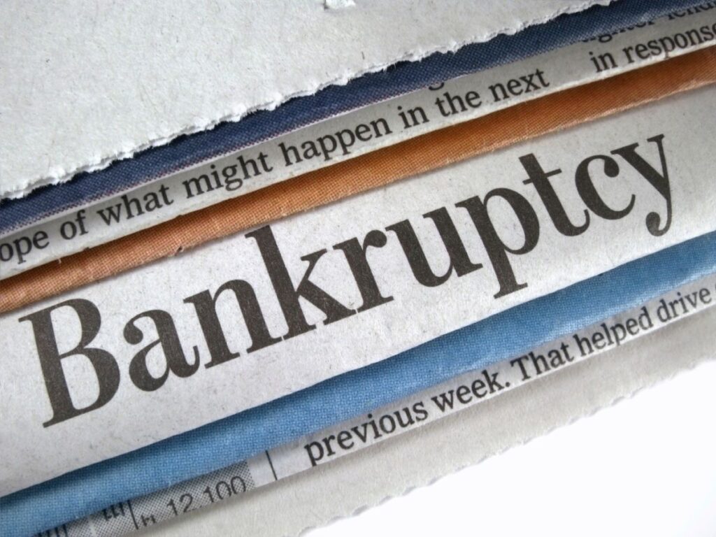 An image of the word bankruptcy written on a newspaper