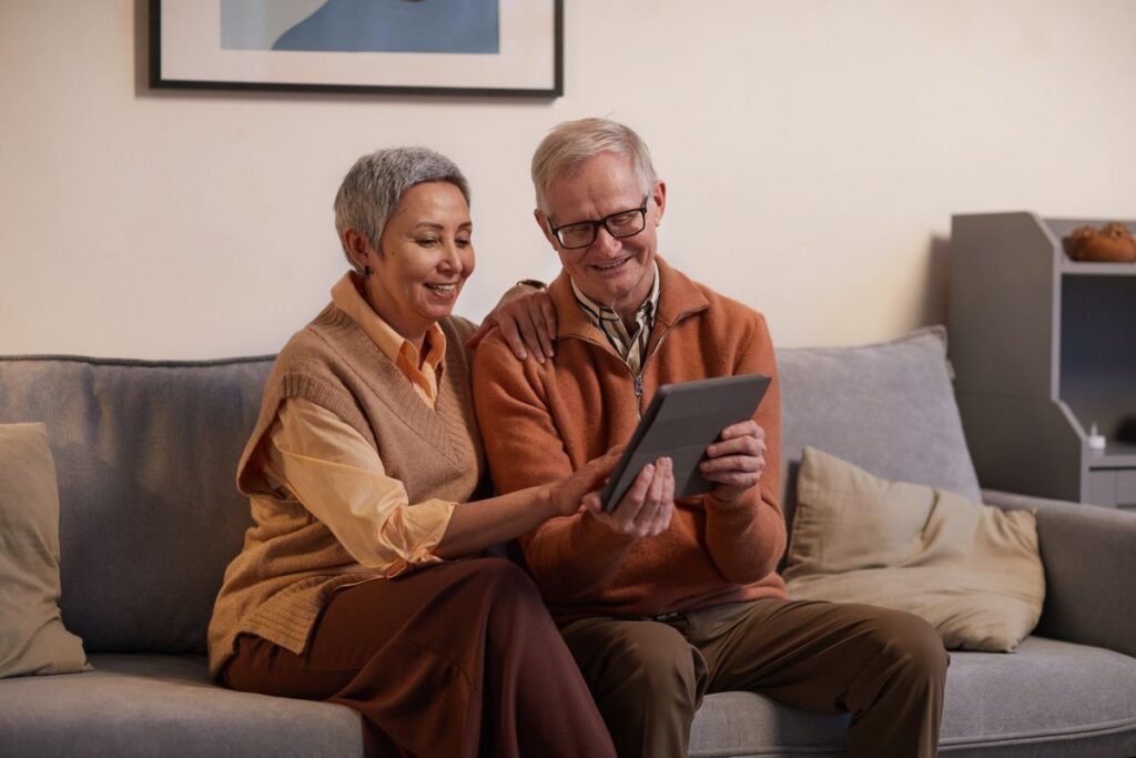 An image of elderly people looking at a phone