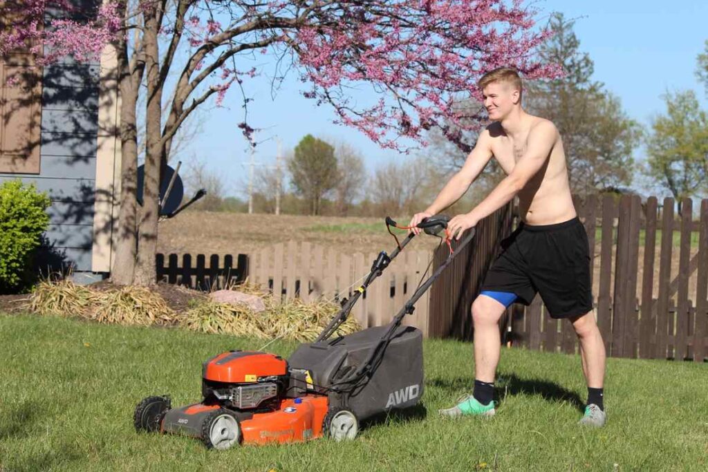 A teen mowing the lawn