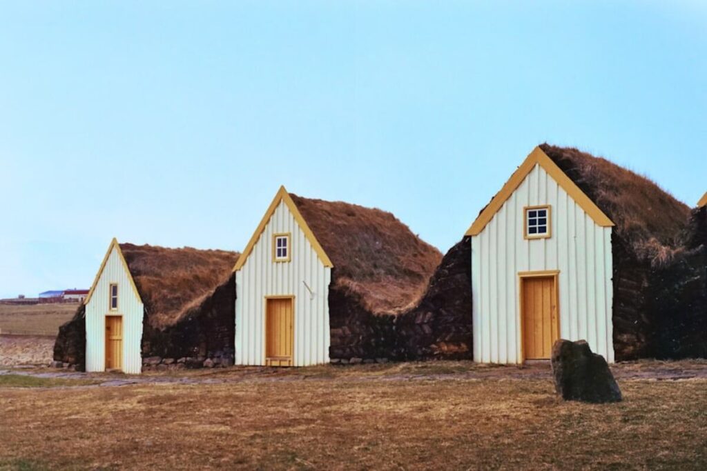 Three white and brown tiny houses