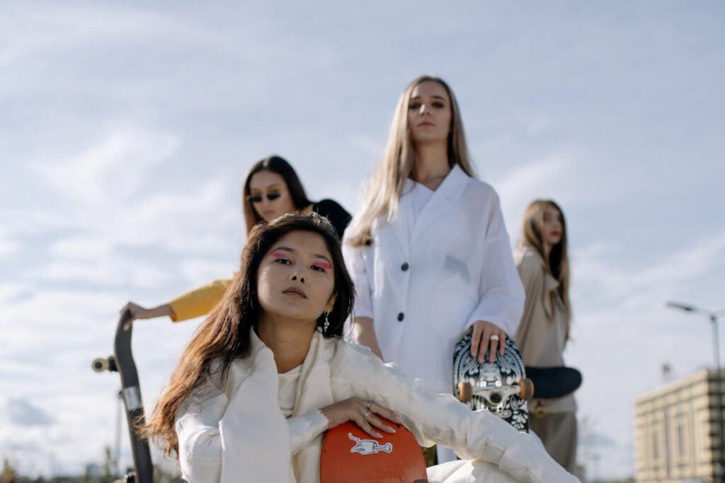 A group of young ladies with skateboards